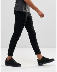 schwarze enge Jeans mit Destroyed-Effekten von Dr. Denim