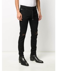 schwarze enge Jeans mit Destroyed-Effekten von Dolce & Gabbana