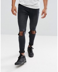 schwarze enge Jeans mit Destroyed-Effekten