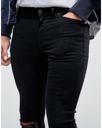 schwarze enge Jeans mit Destroyed-Effekten von Asos