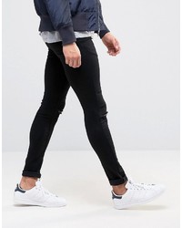 schwarze enge Jeans mit Destroyed-Effekten von Asos