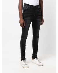 schwarze enge Jeans mit Destroyed-Effekten von Amiri