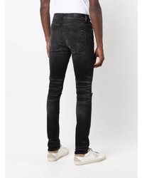 schwarze enge Jeans mit Destroyed-Effekten von Amiri