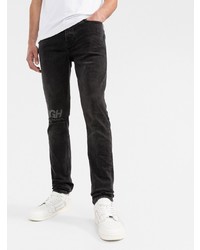 schwarze enge Jeans mit Destroyed-Effekten von Ksubi