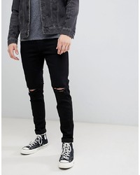 schwarze enge Jeans mit Destroyed-Effekten von Hollister