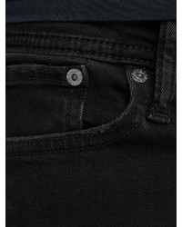 schwarze enge Jeans mit Destroyed-Effekten von Jack & Jones