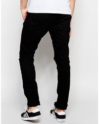 schwarze enge Jeans mit Destroyed-Effekten von Jack and Jones