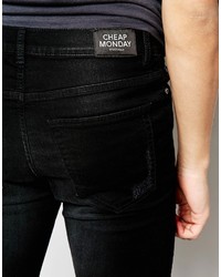 schwarze enge Jeans mit Destroyed-Effekten von Cheap Monday