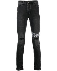 schwarze enge Jeans mit Destroyed-Effekten von Ksubi