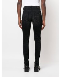 schwarze enge Jeans mit Destroyed-Effekten von Amiri