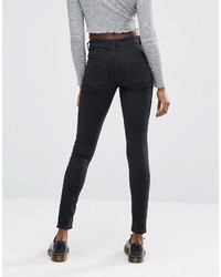 schwarze enge Jeans mit Destroyed-Effekten von Asos