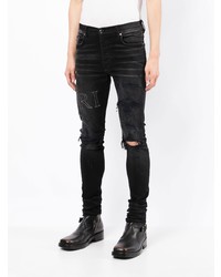 schwarze enge Jeans mit Destroyed-Effekten von Amiri