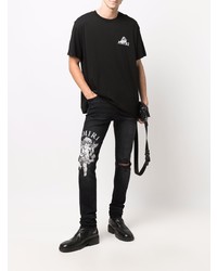 schwarze enge Jeans mit Destroyed-Effekten von Amiri