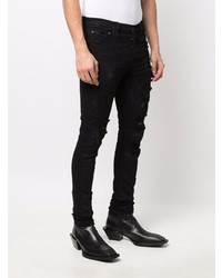 schwarze enge Jeans mit Destroyed-Effekten von Château Lafleur-Gazin