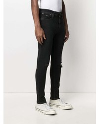 schwarze enge Jeans mit Destroyed-Effekten von Tommy Hilfiger