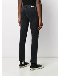 schwarze enge Jeans mit Destroyed-Effekten von Dondup