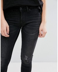 schwarze enge Jeans mit Destroyed-Effekten von Cheap Monday