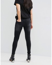 schwarze enge Jeans mit Destroyed-Effekten von Cheap Monday