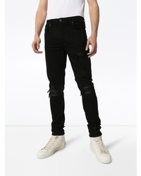 schwarze enge Jeans mit Destroyed-Effekten von Amiri