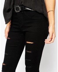 schwarze enge Jeans mit Destroyed-Effekten