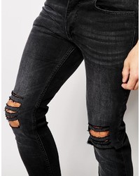 schwarze enge Jeans mit Destroyed-Effekten von Religion
