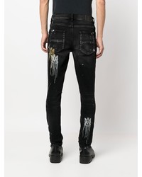 schwarze enge Jeans mit Destroyed-Effekten von Amiri