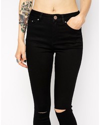 schwarze enge Jeans mit Destroyed-Effekten von Asos