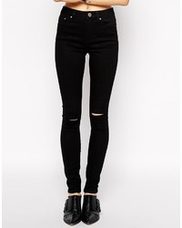 schwarze enge Jeans mit Destroyed-Effekten von Asos