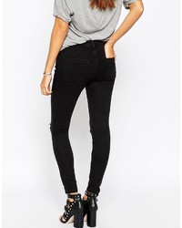 schwarze enge Jeans mit Destroyed-Effekten von Asos