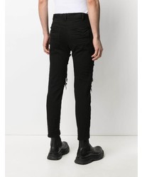 schwarze enge Jeans mit Destroyed-Effekten von Julius
