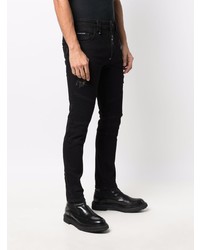 schwarze enge Jeans mit Destroyed-Effekten von Philipp Plein