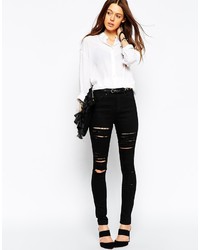 schwarze enge Jeans mit Destroyed-Effekten von Asos