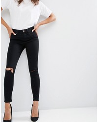 schwarze enge Jeans mit Destroyed-Effekten von Asos