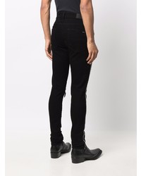 schwarze enge Jeans mit Destroyed-Effekten von Amiri