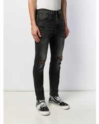 schwarze enge Jeans mit Destroyed-Effekten von R13