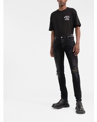 schwarze enge Jeans mit Destroyed-Effekten von Amiri