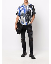 schwarze enge Jeans mit Destroyed-Effekten von Amiri