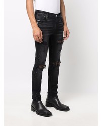 schwarze enge Jeans mit Destroyed-Effekten von Amiri