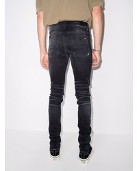 schwarze enge Jeans mit Destroyed-Effekten von Amiri