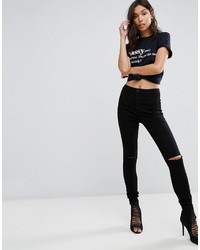 schwarze enge Jeans mit Destroyed-Effekten von Glamorous