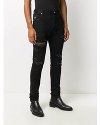 schwarze enge Jeans mit Destroyed-Effekten von Balmain