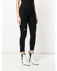 schwarze enge Jeans mit Destroyed-Effekten von J Brand