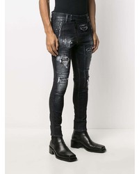 schwarze enge Jeans mit Destroyed-Effekten von DSQUARED2