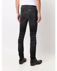 schwarze enge Jeans mit Destroyed-Effekten von Amiri