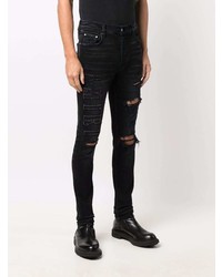 schwarze enge Jeans mit Destroyed-Effekten von Amiri