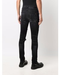 schwarze enge Jeans mit Destroyed-Effekten von Amiri