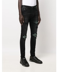 schwarze enge Jeans mit Destroyed-Effekten von Amiri