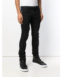 schwarze enge Jeans mit Destroyed-Effekten von Balmain