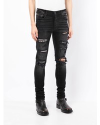 schwarze enge Jeans mit Destroyed-Effekten von Amiri