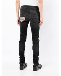 schwarze enge Jeans mit Destroyed-Effekten von Amiri